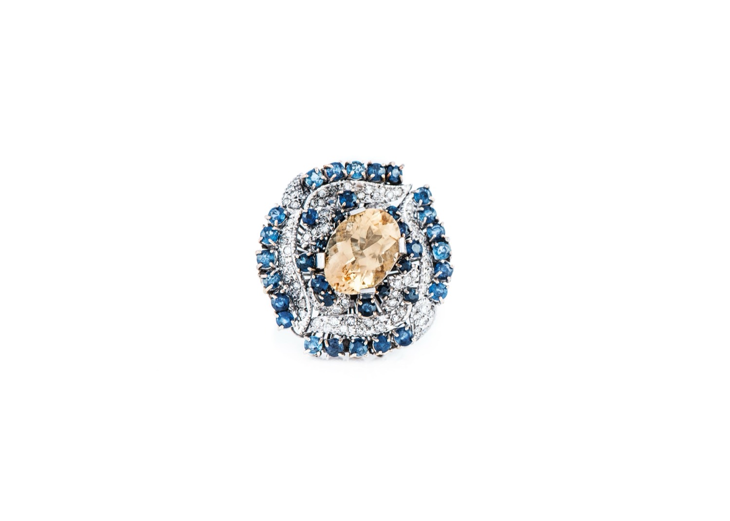 Sapphire and diamond cluster ring around a champagne centre stone